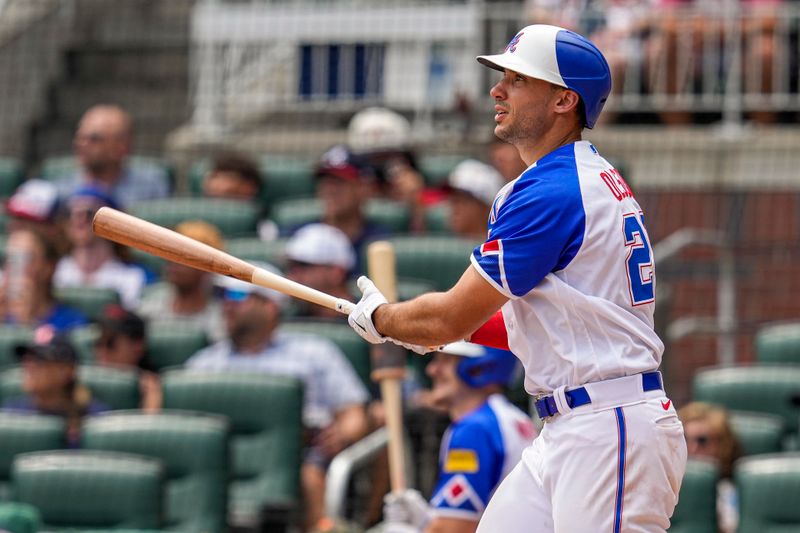 Jul 30, 2023; Cumberland, Georgia, USA; Atlanta Braves first baseman Matt Olson (28) watches the ball after hitting a two run home run against the Milwaukee Brewers during the eighth inning at Truist Park. Mandatory Credit: Dale Zanine-USA TODAY Sports