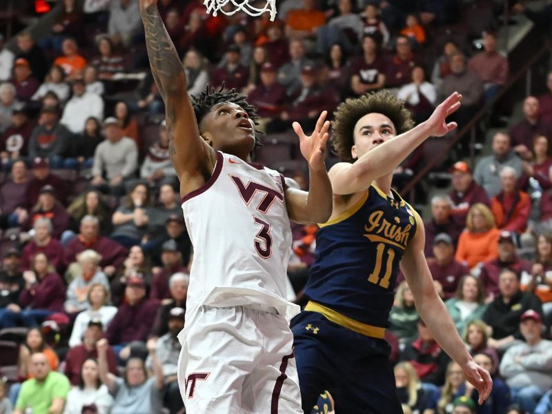 Jan 17, 2026; Blacksburg, Virginia, USA; Virginia Tech Hokies guard Ben Hammond (3) lays the ball up as Notre Dame Fighting Irish guard Braeden Shrewsberry (11) defends during the first half  at Cassell Coliseum. Mandatory Credit: Brian Bishop-Imagn Images