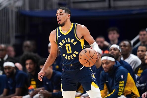 INDIANAPOLIS, INDIANA - NOVEMBER 27: Tyrese Haliburton #0 of the Indiana Pacers dribbles the ball in the first quarter against the Portland Trail Blazers at Gainbridge Fieldhouse on November 27, 2023 in Indianapolis, Indiana. NOTE TO USER: User expressly acknowledges and agrees that, by downloading and or using this photograph, User is consenting to the terms and conditions of the Getty Images License Agreement. (Photo by Dylan Buell/Getty Images)