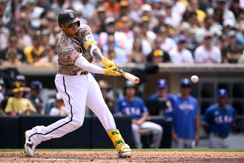 Jul 30, 2023; San Diego, California, USA; San Diego Padres third baseman Manny Machado (13) hits a single against the Texas Rangers during the fourth inning at Petco Park. Mandatory Credit: Orlando Ramirez-USA TODAY Sports