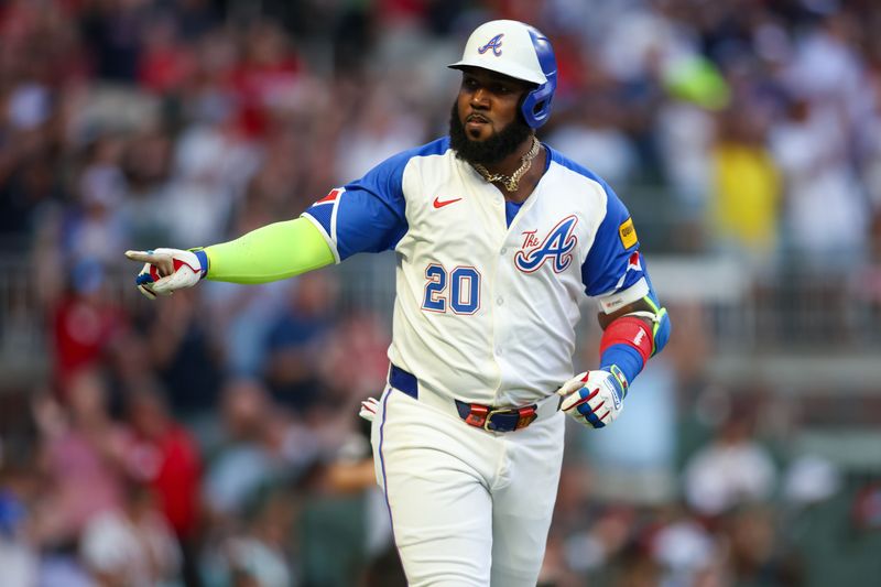 Aug 3, 2024; Atlanta, Georgia, USA; Atlanta Braves designated hitter Marcell Ozuna (20) reacts after a home run against the Miami Marlins in the third inning at Truist Park. Mandatory Credit: Brett Davis-USA TODAY Sports
