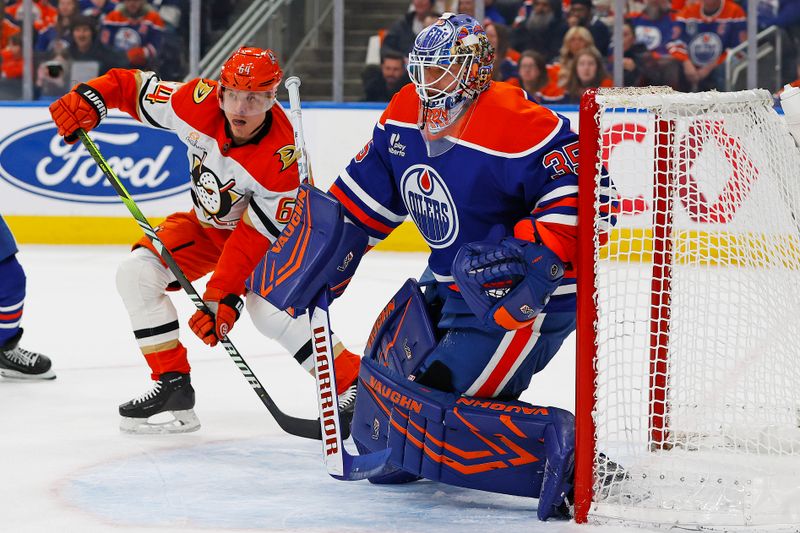 Jan 26, 2026; Edmonton, Alberta, CAN; Anaheim Ducks forward Mikael Granlund (64) looks for a pass behind Edmonton Oilers goaltender Tristan Jarry (35) during the second period at Rogers Place. Mandatory Credit: Perry Nelson-Imagn Images