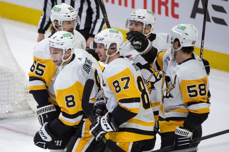 Mar 12, 2024; Ottawa, Ontario, CAN; Pittsburgh Penguins left wing Micheal Bunting (8) celebrates with team his goal scored in the third period against the Ottawa Senators at the Canadian Tire Centre. Mandatory Credit: Marc DesRosiers-USA TODAY Sports