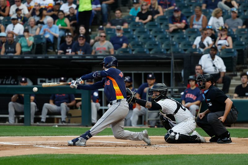 Jun 18, 2024; Chicago, Illinois, USA; Houston Astros third baseman Alex Bregman (2) singles against the Chicago White Sox during the first inning at Guaranteed Rate Field. Mandatory Credit: Kamil Krzaczynski-USA TODAY Sports