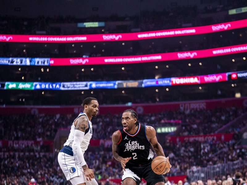 LOS ANGELES, CA - APRIL 23: Kawhi Leonard #2 of the LA Clippers drives to the basket during the game against the Dallas Mavericks during Round 1 Game 2 of the 2024 NBA Playoffs on April 23, 2024 at Crypto.Com Arena in Los Angeles, California. NOTE TO USER: User expressly acknowledges and agrees that, by downloading and/or using this Photograph, user is consenting to the terms and conditions of the Getty Images License Agreement. Mandatory Copyright Notice: Copyright 2024 NBAE (Photo by Tyler Ross/NBAE via Getty Images) <p><br/></p>