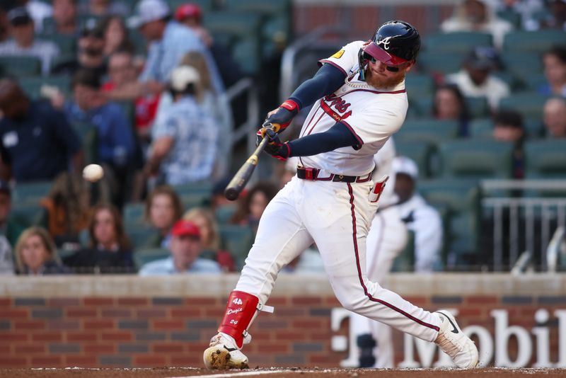 May 4, 2025; Atlanta, Georgia, USA; Atlanta Braves left fielder Alex Verdugo (8) hits a single against the Los Angeles Dodgers in the third inning at Truist Park. Mandatory Credit: Brett Davis-Imagn Images