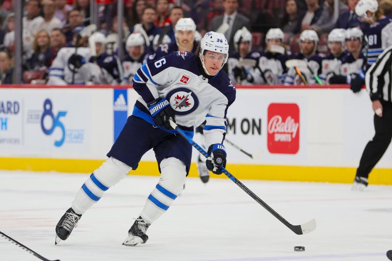 Nov 24, 2023; Sunrise, Florida, USA; Winnipeg Jets center Morgan Barron (36) moves the puck against the Florida Panthers during the second period at Amerant Bank Arena. Mandatory Credit: Sam Navarro-USA TODAY Sports