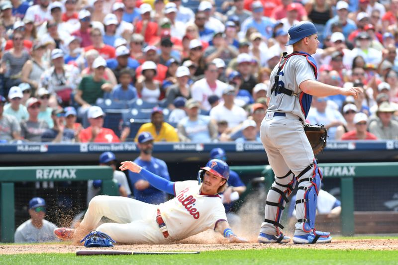 Jun 11, 2023; Philadelphia, Pennsylvania, USA;
Philadelphia Phillies second baseman Bryson Stott (5) sides safely into home against the Los Angeles Dodgers during the sixth inning at Citizens Bank Park. Mandatory Credit: Eric Hartline-USA TODAY Sports