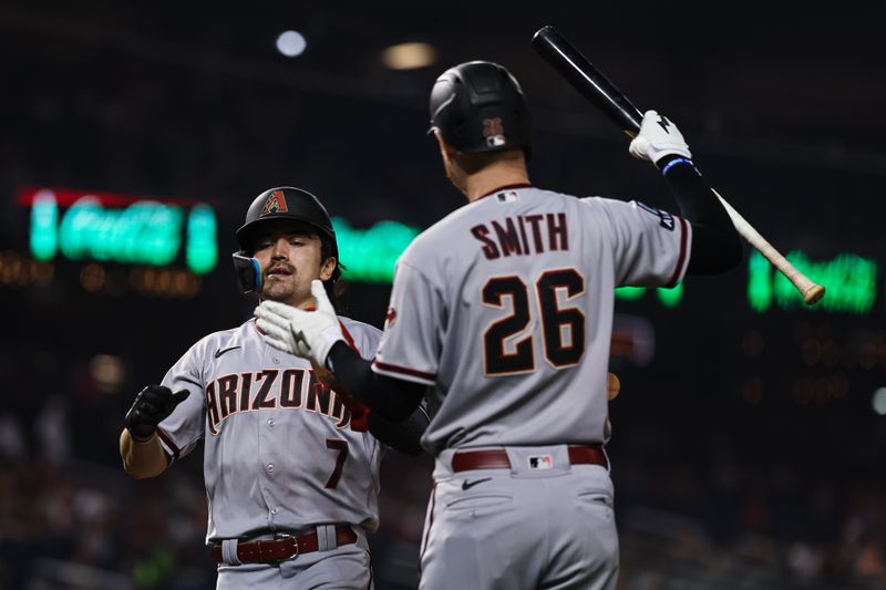 Jun 7, 2023; Washington, District of Columbia, USA; Arizona Diamondbacks left fielder Corbin Carroll (7) celebrates with right fielder Pavin Smith (26) after scoring a run against the Washington Nationals during the seventh inning at Nationals Park. Mandatory Credit: Scott Taetsch-USA TODAY Sports