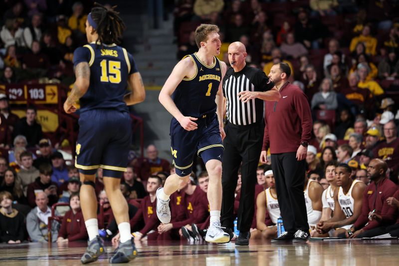 Jan 16, 2025; Minneapolis, Minnesota, USA; Michigan Wolverines center Danny Wolf (1) celebrates his three-point basket against the Minnesota Golden Gophers during the first half at Williams Arena. Mandatory Credit: Matt Krohn-Imagn Images