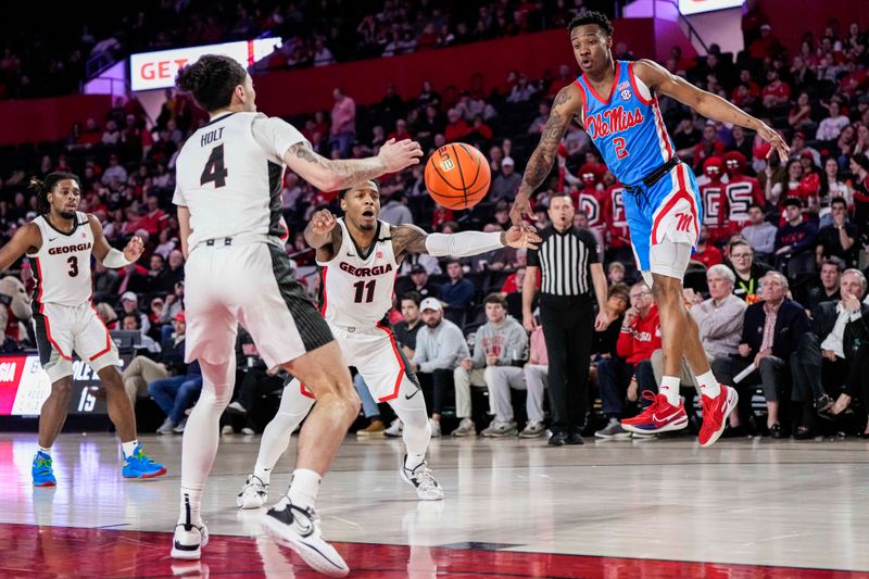 Feb 7, 2023; Athens, Georgia, USA; Mississippi Rebels guard TJ Caldwell (2) and Georgia Bulldogs guards Jusaun Holt (4) and Justin Hill (11) go after the ball during the first half at Stegeman Coliseum. Mandatory Credit: Dale Zanine-USA TODAY Sports