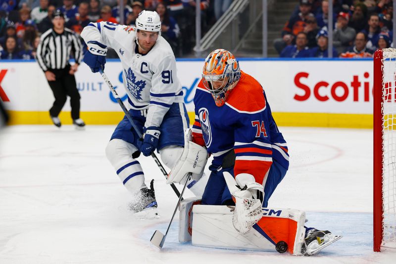 Jan 16, 2024; Edmonton, Alberta, CAN; Toronto Maple Leafs forward John Tavares (91) looks for a rebound in front of Edmonton Oilers goaltender Stuart Skinner (74) during the second period at Rogers Place. Mandatory Credit: Perry Nelson-USA TODAY Sports