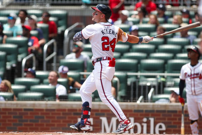 Jul 7, 2024; Atlanta, Georgia, USA; Atlanta Braves center fielder Jarred Kelenic (24) hits a three-run home run against the Philadelphia Phillies in the second inning at Truist Park. Mandatory Credit: Brett Davis-USA TODAY Sports
