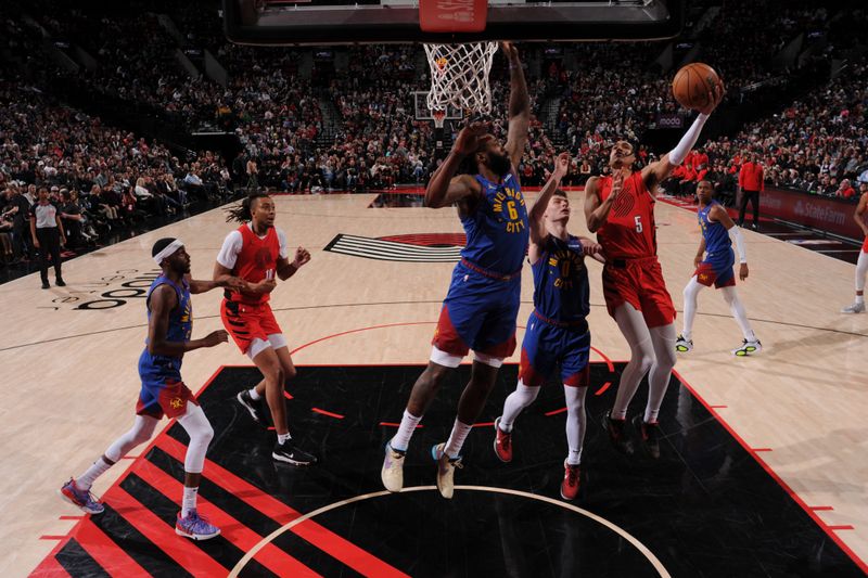 PORTLAND, OR - MARCH 23: Dalano Banton #5 of the Portland Trail Blazers drives to the basket during the game against the Denver Nuggets on March 23, 2024 at the Moda Center Arena in Portland, Oregon. NOTE TO USER: User expressly acknowledges and agrees that, by downloading and or using this photograph, user is consenting to the terms and conditions of the Getty Images License Agreement. Mandatory Copyright Notice: Copyright 2024 NBAE (Photo by Cameron Browne/NBAE via Getty Images)