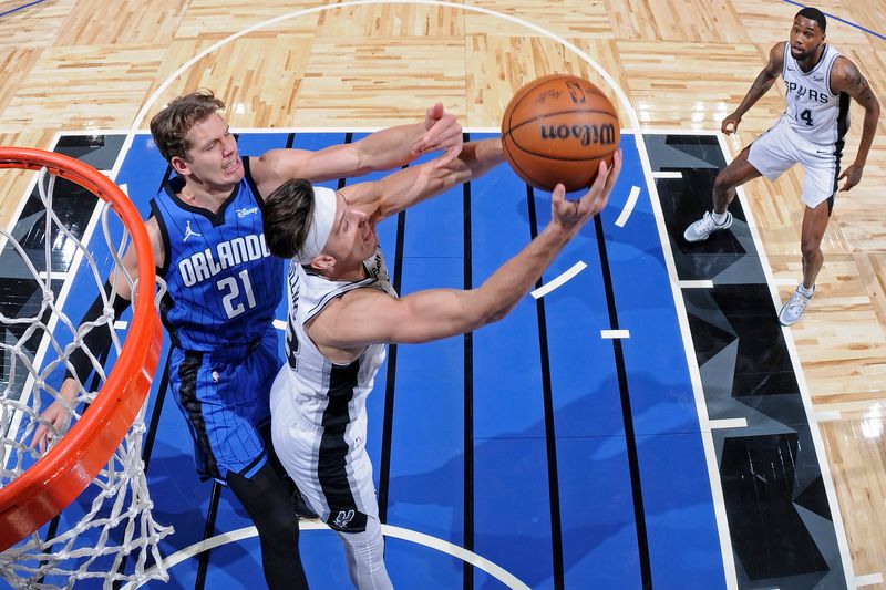 ORLANDO, FL - FEBRUARY 8: Zach Collins #23 of the San Antonio Spurs rebounds during the game against the Orlando Magic on February 8, 2024 at the Kia Center in Orlando, Florida. NOTE TO USER: User expressly acknowledges and agrees that, by downloading and or using this photograph, User is consenting to the terms and conditions of the Getty Images License Agreement. Mandatory Copyright Notice: Copyright 2024 NBAE (Photo by Fernando Medina/NBAE via Getty Images)