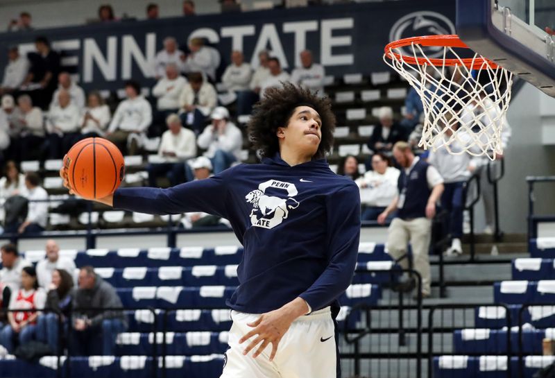 Jan 30, 2025; University Park, Pennsylvania, USA; Penn State Nittany Lions forward Yanic Konan Niederhauser (14) attempts to dunk the ball during a warm up prior to the game against the Ohio State Buckeyes at Rec Hall. Mandatory Credit: Matthew O'Haren-Imagn Images