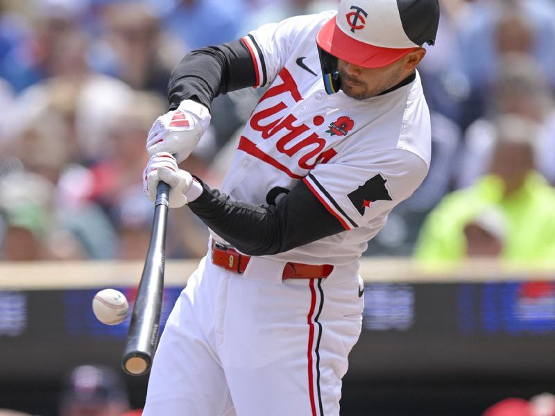 May 27, 2024; Minneapolis, Minnesota, USA; Minnesota Twins designated hitter Trevor Larnach (9) hits a three-run home run against the Kansas City Royals during the fifth inning at Target Field. Mandatory Credit: Nick Wosika-USA TODAY Sports