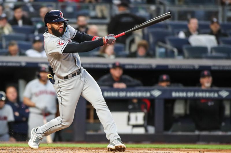 May 2, 2023; Bronx, New York, USA;  Cleveland Guardians shortstop Amed Rosario (1) hits a single in the third inning against the New York Yankees at Yankee Stadium. Mandatory Credit: Wendell Cruz-USA TODAY Sports