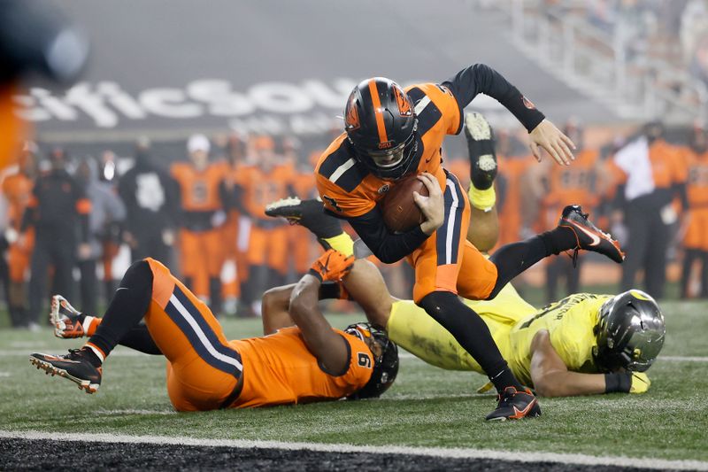 Nov 27, 2020; Corvallis, Oregon, USA; Oregon State Beavers quarterback Tristan Gebbia (3) runs into the end zone for a touchdown against the Oregon Ducks during the second half at Reser Stadium. Mandatory Credit: Soobum Im-USA TODAY Sports