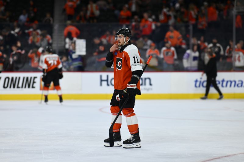 Oct 19, 2024; Philadelphia, Pennsylvania, USA; Philadelphia Flyers right wing Travis Konecny (11) looks on after the game against the Vancouver Canucks at Wells Fargo Center. Mandatory Credit: Kyle Ross-Imagn Images