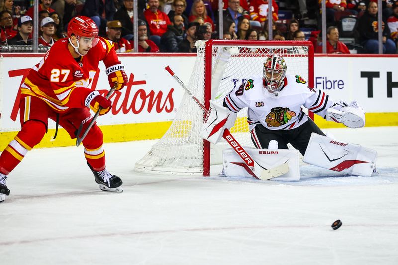 Nov 7, 2025; Calgary, Alberta, CAN; Chicago Blackhawks goaltender Spencer Knight (30) guards his net against Calgary Flames right wing Matt Coronato (27) during the second period at Scotiabank Saddledome. Mandatory Credit: Sergei Belski-Imagn Images