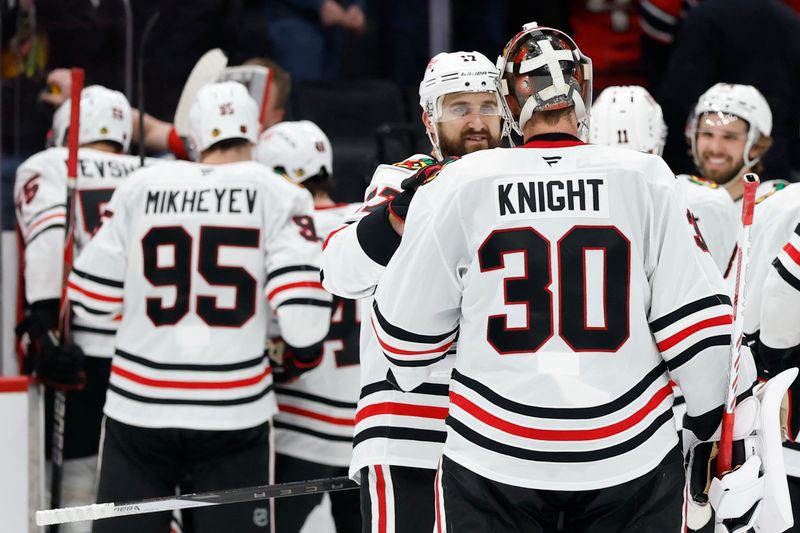 Jan 3, 2026; Washington, District of Columbia, USA; Chicago Blackhawks left wing Nick Foligno (17) celebrates with Blackhawks goaltender Spencer Knight (30) after scoring the game winning goal against the Washington Capitals in a shootout at Capital One Arena. Mandatory Credit: Geoff Burke-Imagn Images
