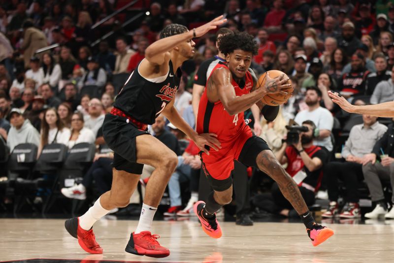 PORTLAND, OREGON - APRIL 12: Jalen Green #4 of the Houston Rockets drives to the basket as Rayan Rupert #72 of the Portland Trail Blazers defends during the first quarter at Moda Center on April 12, 2024 in Portland, Oregon. NOTE TO USER: User expressly acknowledges and agrees that, by downloading and or using this photograph, User is consenting to the terms and conditions of the Getty Images License Agreement.? (Photo by Amanda Loman/Getty Images)