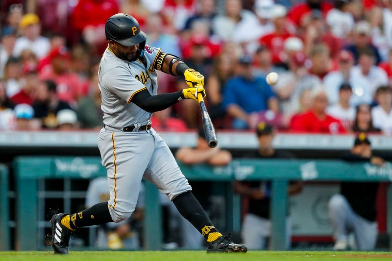 Sep 22, 2023; Cincinnati, Ohio, USA; Pittsburgh Pirates left fielder Miguel Andujar (26) hits a double against the Cincinnati Reds in the second inning at Great American Ball Park. Mandatory Credit: Katie Stratman-USA TODAY Sports