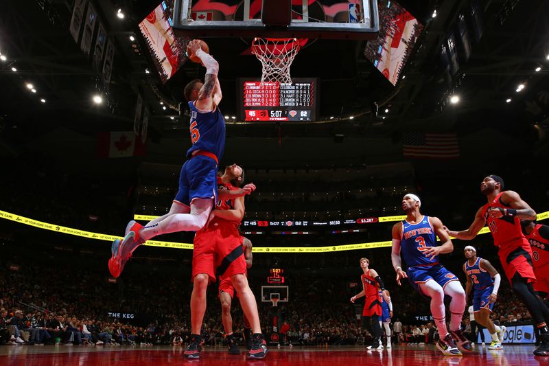 TORONTO, CANADA - MARCH 27: Isaiah Hartenstein #55 of the New York Knicks dunks the ball during the game against the Toronto Raptors on March 27, 2024 at the Scotiabank Arena in Toronto, Ontario, Canada.  NOTE TO USER: User expressly acknowledges and agrees that, by downloading and or using this Photograph, user is consenting to the terms and conditions of the Getty Images License Agreement.  Mandatory Copyright Notice: Copyright 2024 NBAE (Photo by Vaughn Ridley/NBAE via Getty Images)