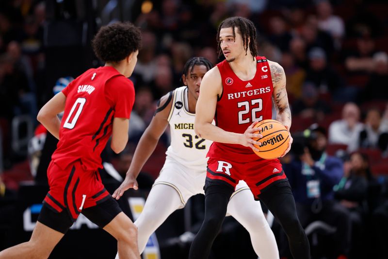 Mar 9, 2023; Chicago, IL, USA; Rutgers Scarlet Knights guard Caleb McConnell (22) looks to pass against the Michigan Wolverines during the second half at United Center. Mandatory Credit: Kamil Krzaczynski-USA TODAY Sports