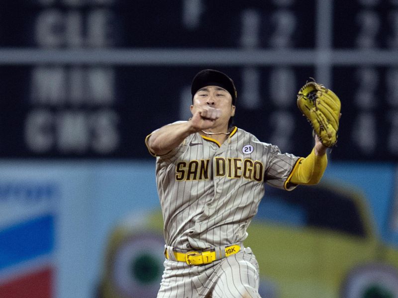 Sep 15, 2023; Oakland, California, USA; San Diego Padres second baseman Ha-Seong Kim (7) leaves his feet to throw out Oakland Athletics first baseman Ryan Noda at first base on a grounder to the hole during the eighth inning at Oakland-Alameda County Coliseum. Mandatory Credit: D. Ross Cameron-USA TODAY Sports