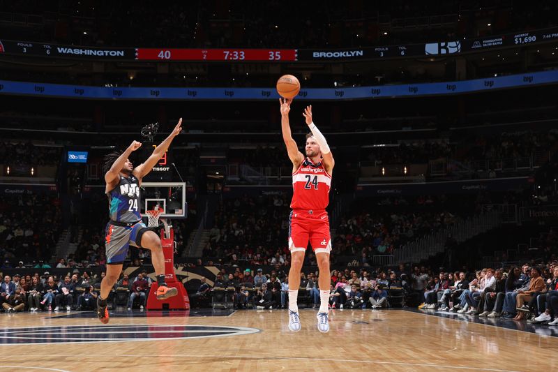 WASHINGTON, DC -? MARCH 27:  Corey Kispert #24 of the Washington Wizards shoots a three point basket during the game against the Brooklyn Nets on March 27, 2024 at Capital One Arena in Washington, DC. NOTE TO USER: User expressly acknowledges and agrees that, by downloading and or using this Photograph, user is consenting to the terms and conditions of the Getty Images License Agreement. Mandatory Copyright Notice: Copyright 2024 NBAE (Photo by Stephen Gosling/NBAE via Getty Images)