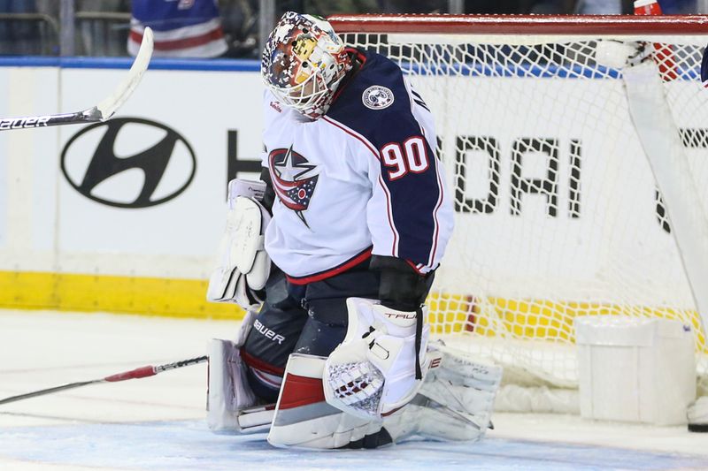 Nov 12, 2023; New York, New York, USA;  Columbus Blue Jackets goaltender Elvis Merzlikins (90) reacts after allowing a game tying goal with eleven seconds remains in the third period against the New York Rangers at Madison Square Garden. Mandatory Credit: Wendell Cruz-USA TODAY Sports