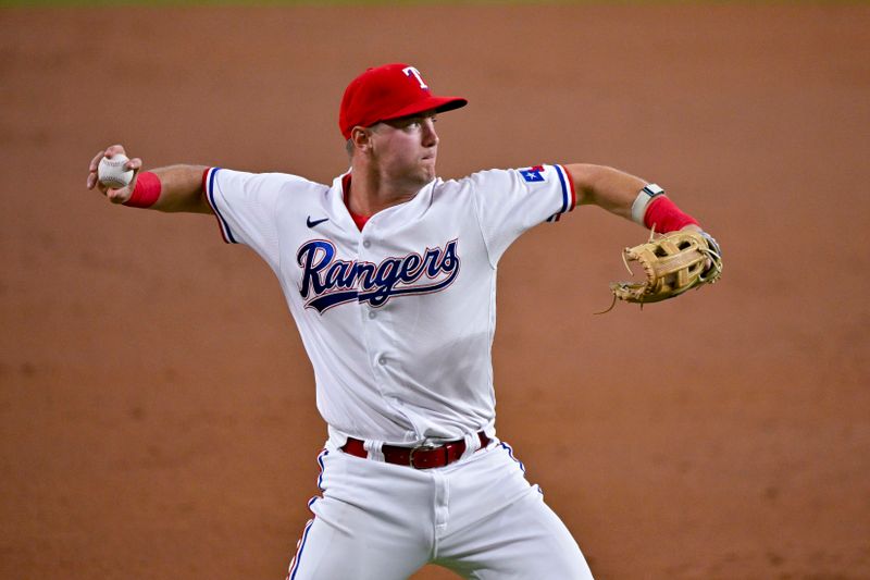 May 16, 2023; Arlington, Texas, USA; Texas Rangers third baseman Josh Jung (6) throws out Atlanta Braves center fielder Michael Harris II (not pictured) during the second inning at Globe Life Field. Mandatory Credit: Jerome Miron-USA TODAY Sports