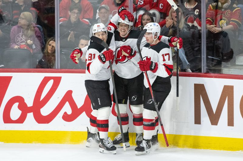 Dec 9, 2025; Ottawa, Ontario, CAN; New Jersey Devils right wing Arseny Gritsyuk (81-left) and defenseman Simon Nemec (17-right) celebrate a goal scored by center Cody Glass (12-center) in the third period against the  Ottawa Senators at the Canadian Tire Centre. Mandatory Credit: Marc DesRosiers-IMAGN Images