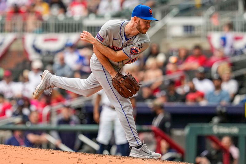 Apr 11, 2024; Cumberland, Georgia, USA; New York Mets relief pitcher Tyler Jay (74) pitches against the Atlanta Braves during his major league debut during the eighth inning at Truist Park. Mandatory Credit: Dale Zanine-USA TODAY Sports