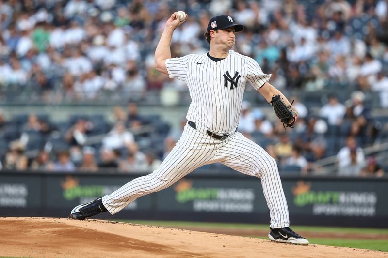 Jul 19, 2024; Bronx, New York, USA;  New York Yankees starting pitcher Gerrit Cole (45) pitches in the first inning against the Tampa Bay Rays at Yankee Stadium. Mandatory Credit: Wendell Cruz-USA TODAY Sports