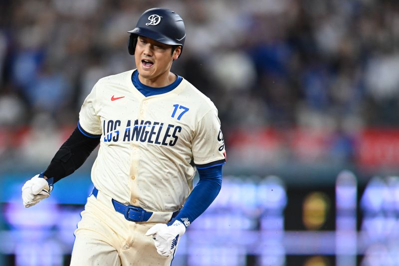 Sep 21, 2024; Los Angeles, California, USA; Los Angeles Dodgers designated hitter Shohei Ohtani (17) reacts after outfielder Mookie Betts (50) (not pictured) hits a home run against the Colorado Rockies during the third inning at Dodger Stadium. Mandatory Credit: Jonathan Hui-Imagn Images