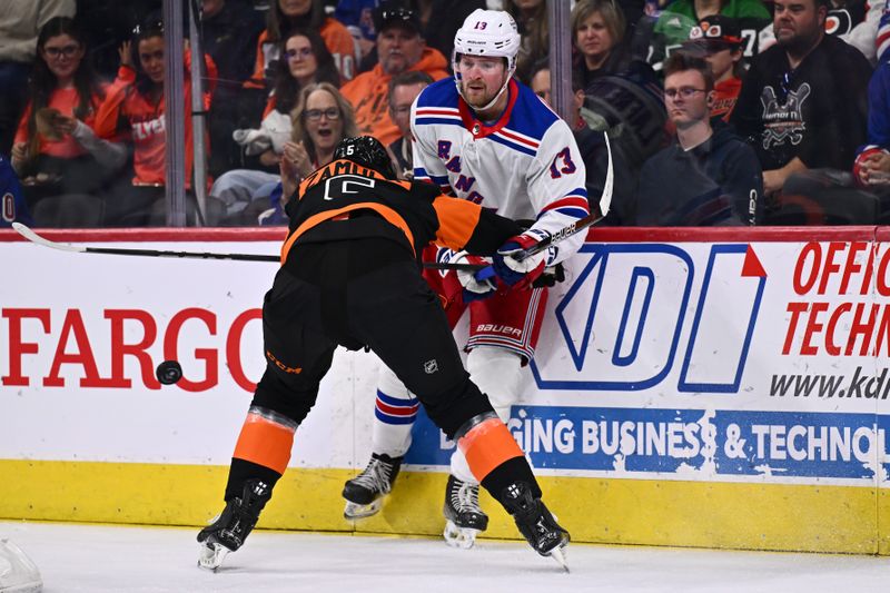 Nov 24, 2023; Philadelphia, Pennsylvania, USA; Philadelphia Flyers defenseman Egor Zamula (5) hits New York Rangers left wing Alexis Lafreniere (13) in the first period at Wells Fargo Center. Mandatory Credit: Kyle Ross-USA TODAY Sports