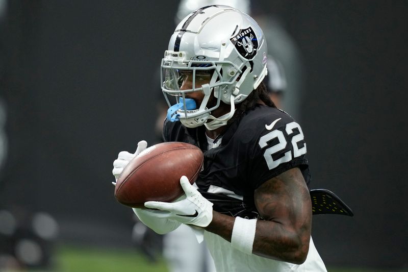 Las Vegas Raiders running back Ameer Abdullah (22) warms up before an NFL football game against the New England Patriots, Sunday, Oct. 15, 2023, in Las Vegas. (AP Photo/John Locher)