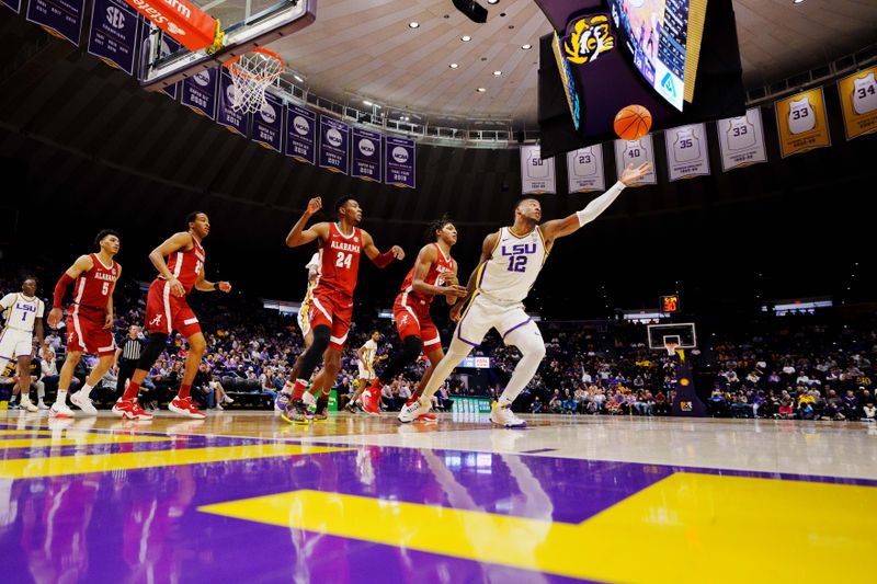 Feb 4, 2023; Baton Rouge, Louisiana, USA; LSU Tigers forward KJ Williams (12) reaches for a rebound against the Alabama Crimson Tide during the first half at Pete Maravich Assembly Center. Mandatory Credit: Andrew Wevers-USA TODAY Sports