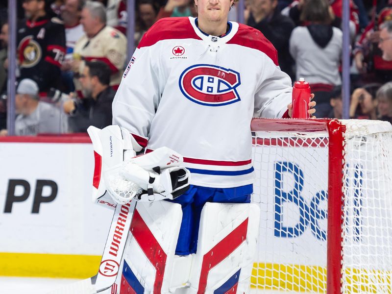 Apr 11, 2025; Ottawa, Ontario, CAN; Montreal Canadiens goalie Sam Montembeault (35) reacts to a goal scored by the Ottawa Senators  in the first period at the Canadian Tire Centre. Mandatory Credit: Marc DesRosiers-Imagn Images