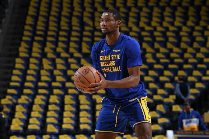 SAN FRANCISCO, CA - FEBRUARY 25:  Jonathan Kuminga #00 of the Golden State Warriors warms up before the game against the Denver Nuggets on February 25, 2024 at Chase Center in San Francisco, California. NOTE TO USER: User expressly acknowledges and agrees that, by downloading and or using this photograph, user is consenting to the terms and conditions of Getty Images License Agreement. Mandatory Copyright Notice: Copyright 2024 NBAE (Photo by Noah Graham/NBAE via Getty Images)