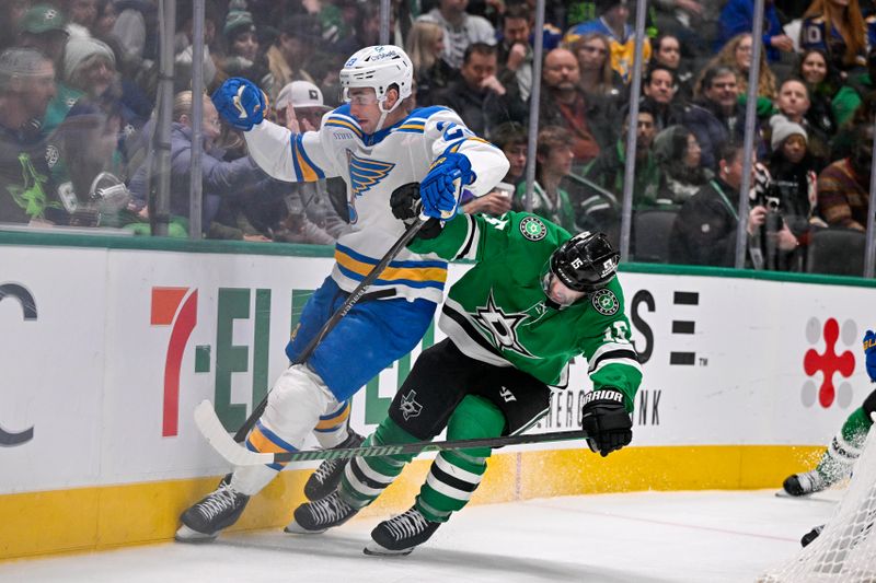 Jan 23, 2026; Dallas, Texas, USA; St. Louis Blues defenseman Logan Mailloux (23) and Dallas Stars center Colin Blackwell (15) chase the puck during the second period at the American Airlines Center. Mandatory Credit: Jerome Miron-Imagn Images