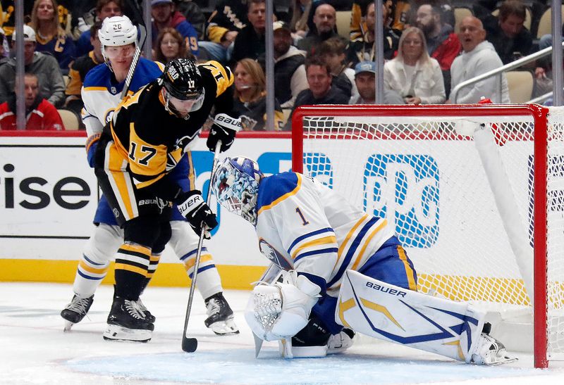 Oct 16, 2024; Pittsburgh, Pennsylvania, USA; Buffalo Sabres goaltender Ukko-Pekka Luukkonen (1) makes a save against Pittsburgh Penguins right wing Bryan Rust (17) during the third period at PPG Paints Arena. Mandatory Credit: Charles LeClaire-Imagn Images