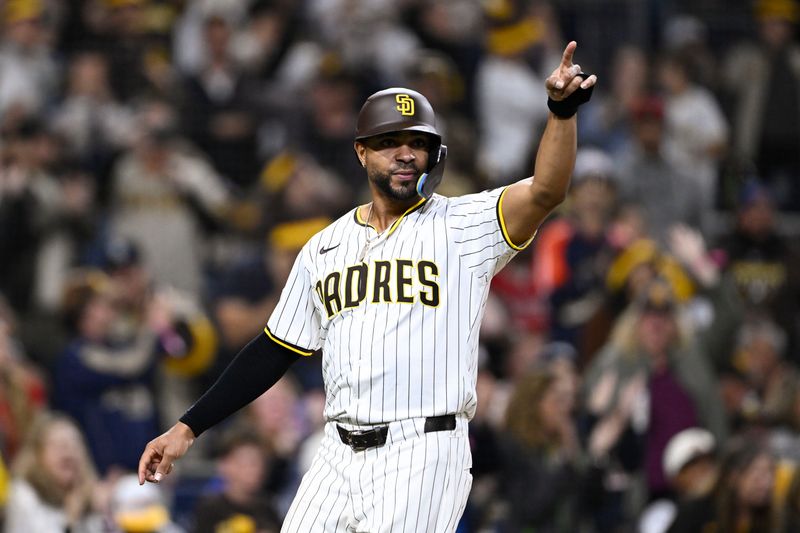 May 14, 2025; San Diego, California, USA; San Diego Padres shortstop Xander Bogaerts (2) points out to the outfield after scoring during the eighth inning against the Los Angeles Angels at Petco Park. Mandatory Credit: Denis Poroy-Imagn Images