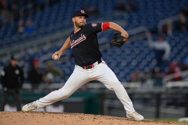 Apr 4, 2024; Washington, District of Columbia, USA; Washington Nationals relief pitcher Tanner Rainey (21) throws a pitch during the seventh inning against the Pittsburgh Pirates at Nationals Park. Mandatory Credit: Reggie Hildred-USA TODAY Sports