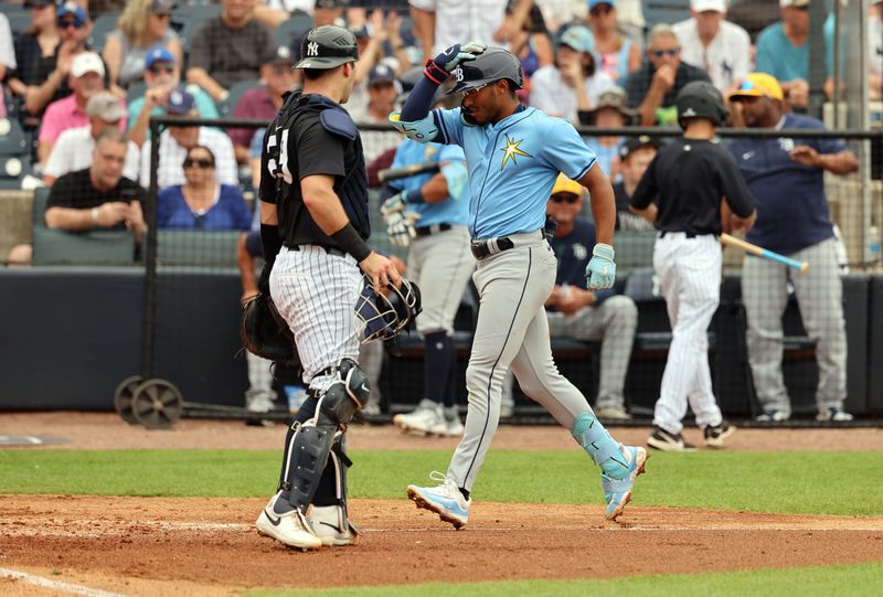 Mar 6, 2024; Tampa, Florida, USA;  Tampa Bay Rays outfielder Richie Palacios (1) runs home as he hits a 2-run home run during the fourth inning as New York Yankees catcher Luis Torrens (29) looks on at George M. Steinbrenner Field. Mandatory Credit: Kim Klement Neitzel-USA TODAY Sports