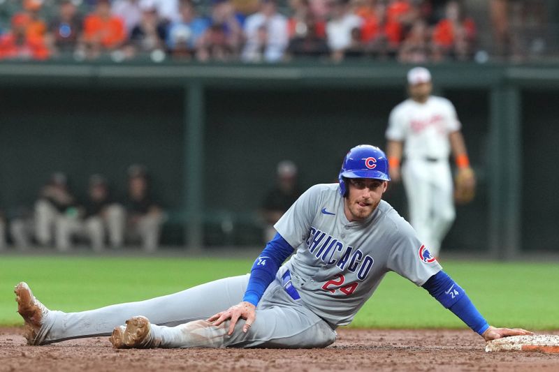 Jul 10, 2024; Baltimore, Maryland, USA; Chicago Cubs outfielder Cody Bellinger (24) steals second base in the third inning against the Baltimore Orioles at Oriole Park at Camden Yards. Mandatory Credit: Mitch Stringer-USA TODAY Sports