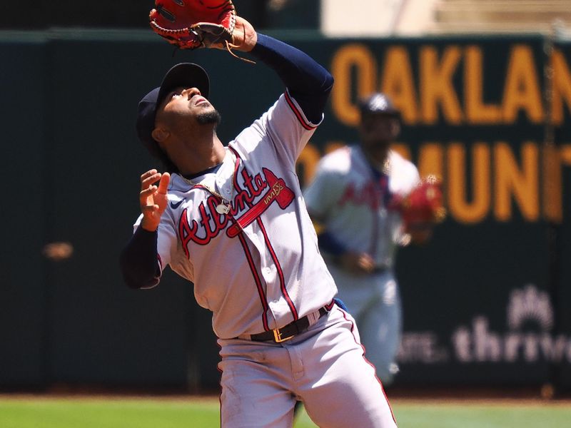 May 31, 2023; Oakland, California, USA; Atlanta Braves second baseman Ozzie Albies (1) catches the ball against the Oakland Athletics during the first inning at Oakland-Alameda County Coliseum. Mandatory Credit: Kelley L Cox-USA TODAY Sports